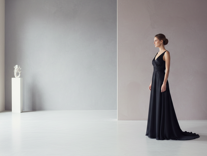 more minimal background, and woman standing on the right side of the room